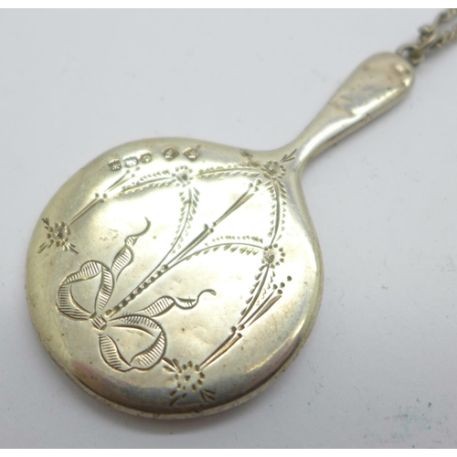 856 - A miniature silver hand mirror, Birmingham 1921, on a silver chain