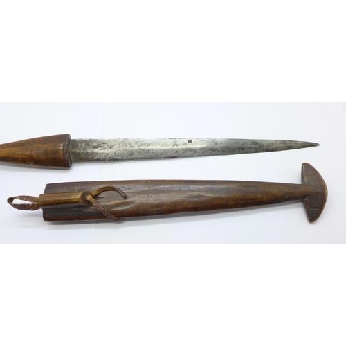 860a - An African dagger with carved wooden handle and scabbard, 39cm with scabbard