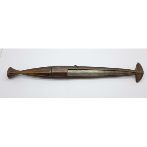 860a - An African dagger with carved wooden handle and scabbard, 39cm with scabbard