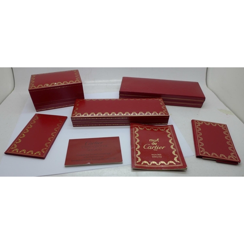 870 - Three Cartier boxes and booklets, (two pen, one watch)