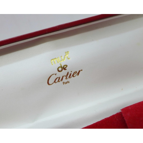 870 - Three Cartier boxes and booklets, (two pen, one watch)