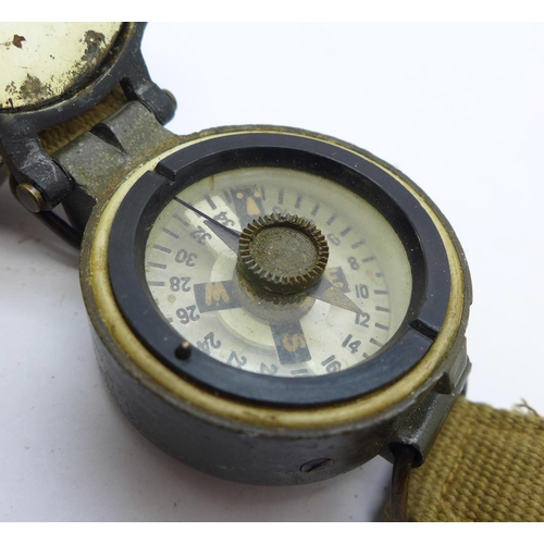 875 - A military compass and a wristwatch case