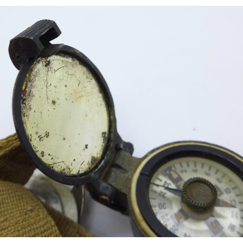 875 - A military compass and a wristwatch case