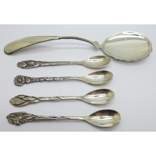 892 - A Dutch silver spoon, 31g and four plated Dutch Arts and Crafts spoons