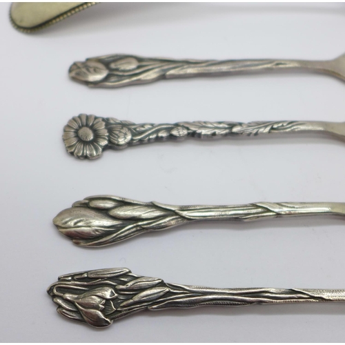 892 - A Dutch silver spoon, 31g and four plated Dutch Arts and Crafts spoons