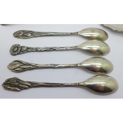 892 - A Dutch silver spoon, 31g and four plated Dutch Arts and Crafts spoons