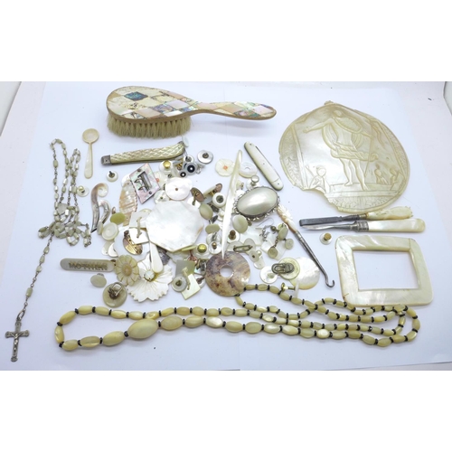 925 - A collection of mother of pearl including a necklace, two brooches, a silver bladed knife, a/f, butt... 