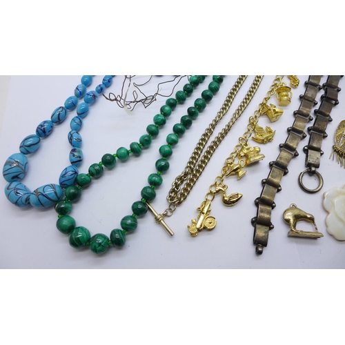 933 - A collection of jewellery including a white metal collar, no fastener, malachite beads, a charm brac... 