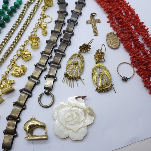 933 - A collection of jewellery including a white metal collar, no fastener, malachite beads, a charm brac... 