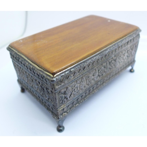 935 - A white metal box with olive wood top and a gilt metal velvet lined box with crest of arms on the li... 