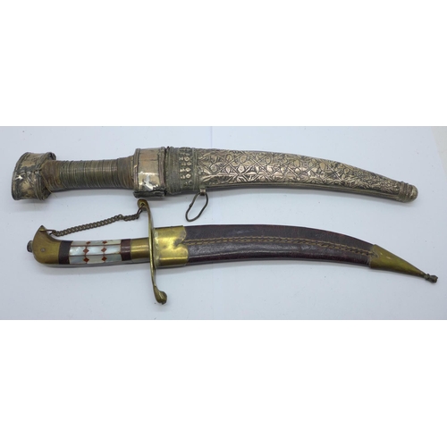 942 - Two Eastern daggers with scabbards, one with mother of pearl handle