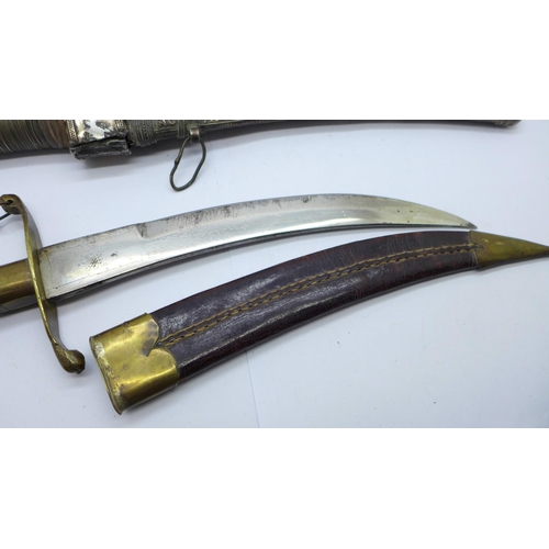 942 - Two Eastern daggers with scabbards, one with mother of pearl handle