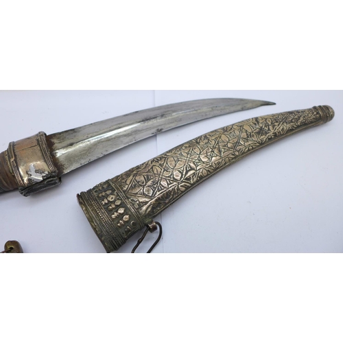 942 - Two Eastern daggers with scabbards, one with mother of pearl handle