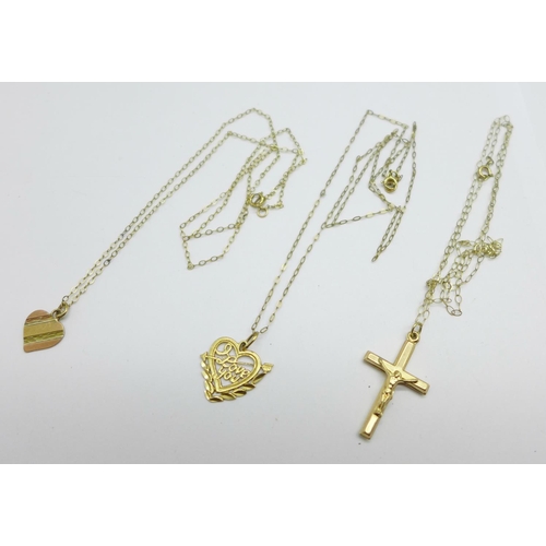 960 - Three 9ct gold pendants on fine chains, total weight 2.5g