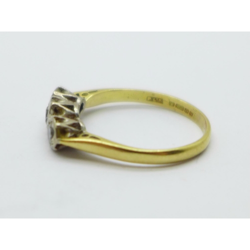 987 - An 18ct gold, three stone diamond ring, 3.2g, R