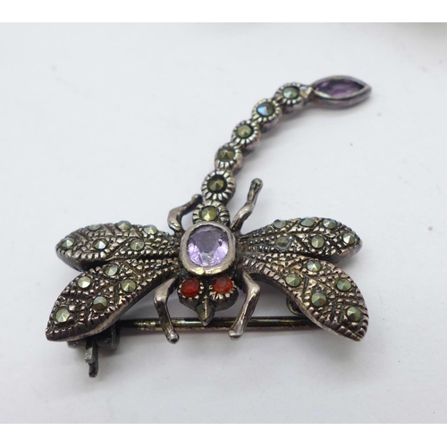 997 - An 800 silver and stone set dragonfly brooch, one other dragonfly brooch, a silver bangle, two silve... 