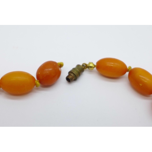 998 - A set of butterscotch amber coloured beads, a/f