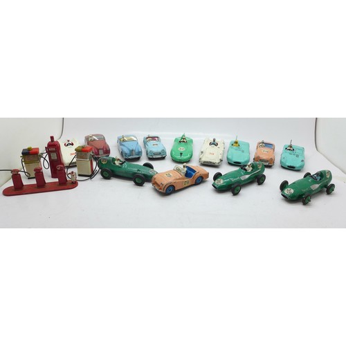 785 - Thirteen Dinky Toys die-cast vehicles and four petrol pumps