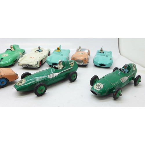 785 - Thirteen Dinky Toys die-cast vehicles and four petrol pumps