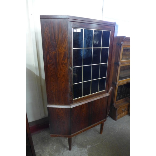 102 - A Danish rosewood freestanding corner cabinet, 139cms h, 85cms w, 54cms d  

*Accompanied by CITES A... 