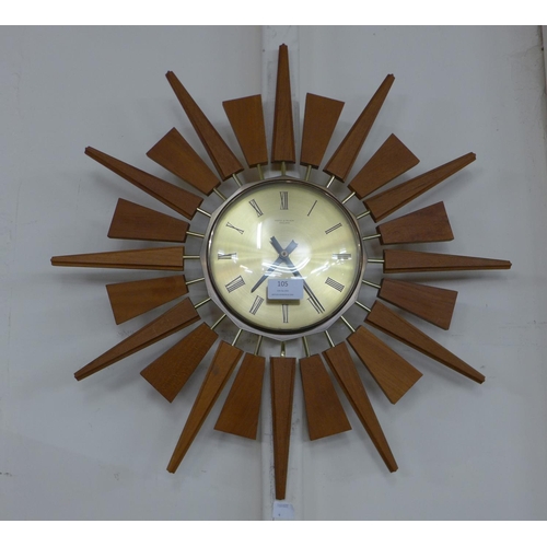 105 - An Astey & Wilson teak sunburst wall clock