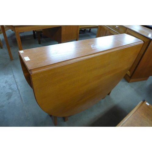 119 - A teak drop-leaf table