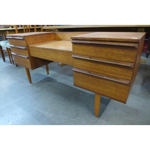 130 - A teak dressing table