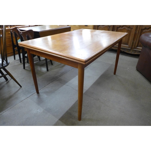 142 - A Danish A.M. Mobelfabrik teak extending dining table