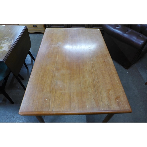 142 - A Danish A.M. Mobelfabrik teak extending dining table