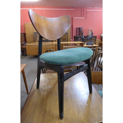 145 - A G-Plan Librenza tola wood and black lacquered drop-leaf table and four butterfly back chairs