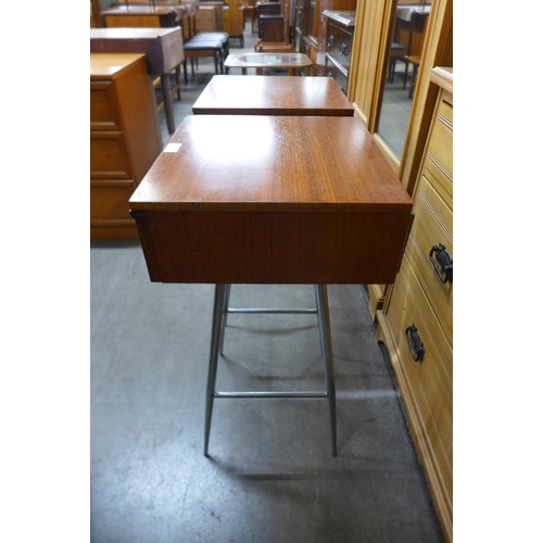 147 - A pair of teak and chrome bedside tables