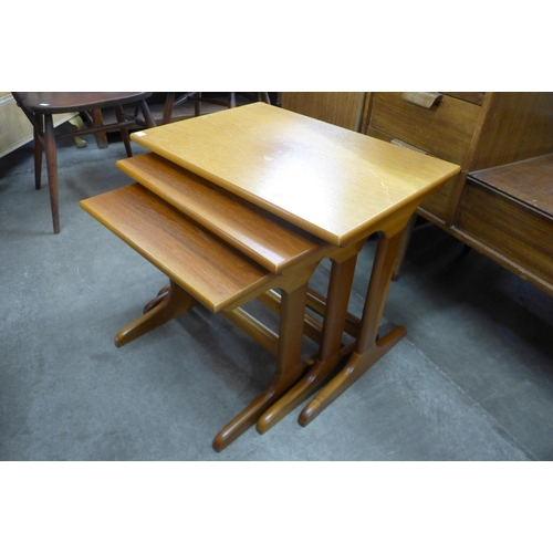 159 - A Nathan teak telephone seat and a teak nest of tables