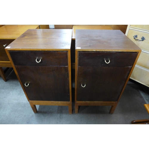 160 - A Uniflex teak and afromosia dressing table and pair of matching bedside cupboards