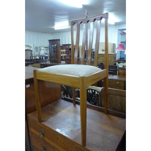 161c - A teak drop-leaf table and four chairs