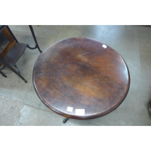 203 - A mahogany and oak circular tripod table