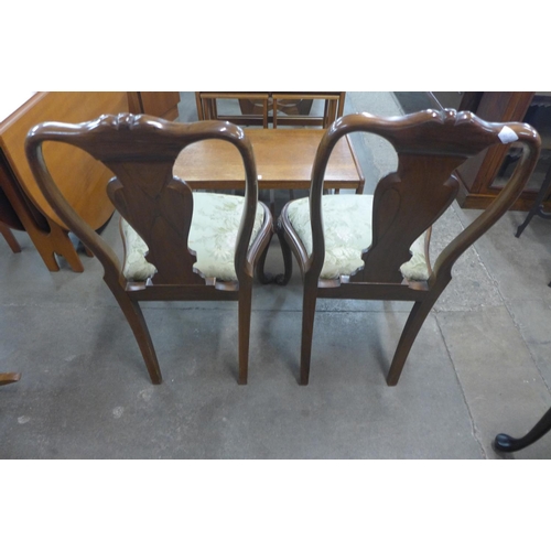 205 - A pair of George l style walnut side chairs