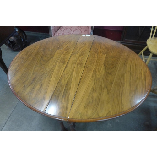 207 - A Victorian walnut Sutherland table, 71cms h x 88cms l