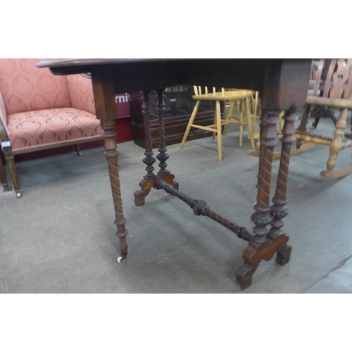 207 - A Victorian walnut Sutherland table, 71cms h x 88cms l