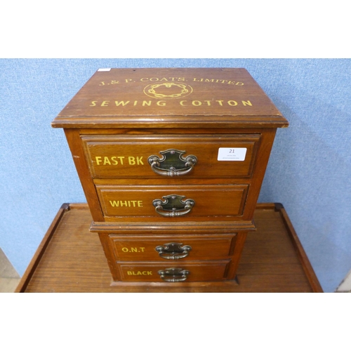 21 - An early 20th Century walnut four drawer counter top haberdashery shop cabinet, bearing J&P Coates L... 