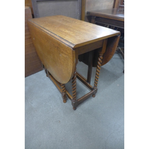 210 - An oak barleytwist gateleg table