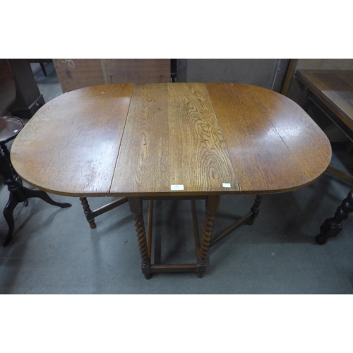 210 - An oak barleytwist gateleg table