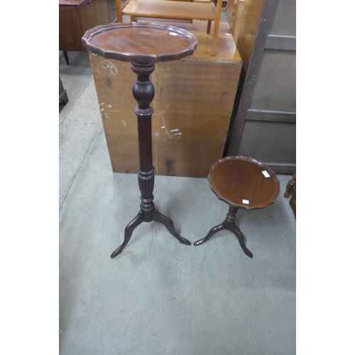 212 - A mahogany torchere and a wine table