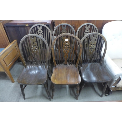 216 - A set of six beech wheelback chairs