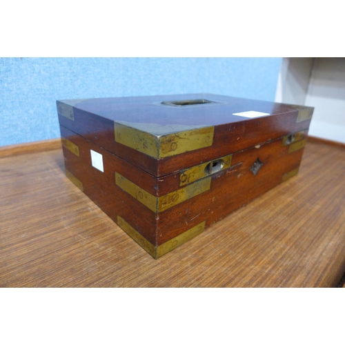 22 - A 19th Century mahogany and brass mounted military campaign cigarette/cigar box, 10cms h, 27cms w, 1... 