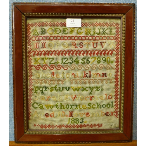 25 - A Victorian sampler, dated 1883, 29 x 24cms, framed