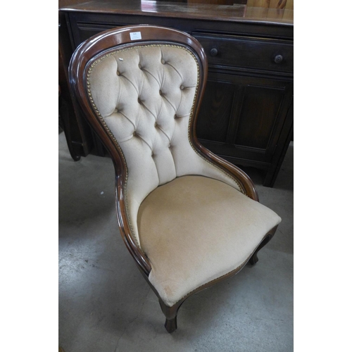 324 - A Victorian style mahogany and upholstered nursing chair