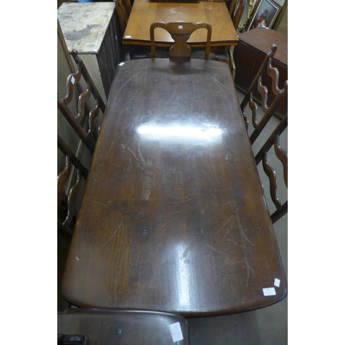 325 - An Ercol Old Colonial dark elm dresser, refectory table and six ladderback chairs