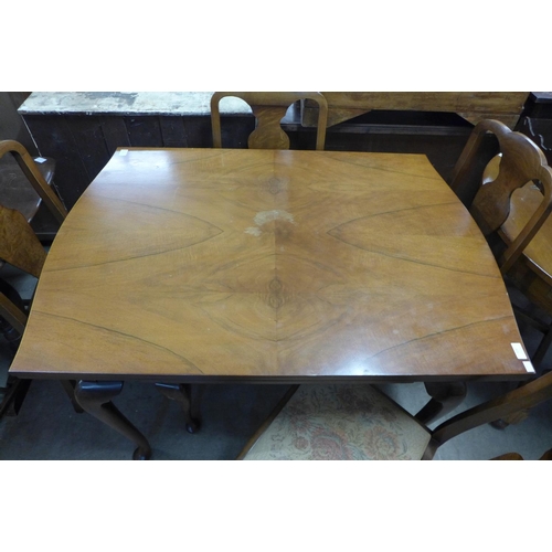 326 - A walnut draw-leaf dining table and four chairs