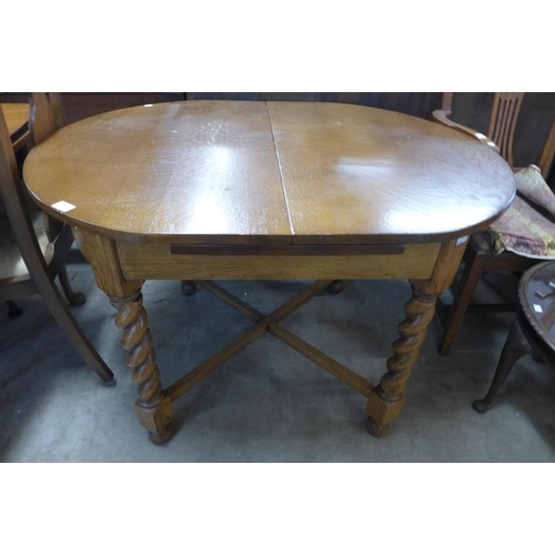 327 - An oak barleytwist draw-leaf table