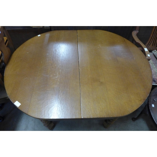 327 - An oak barleytwist draw-leaf table